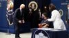 President Joe Biden watches as Linda Bussey receives the first round of the COVID-19 vaccine during an event to commemorate the 50 millionth vaccination at the White House, Feb. 25, 2021.