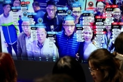 資料照：中國福建省福州市舉辦的中國數字技術展覽會上參觀者的臉部在人臉識別技術屏幕上顯示。（2019年5月8日）