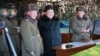 Undated photo released by North Korea's official Korean Central News Agency (KCNA) on Feb. 21, 2016 shows North Korean leader Kim Jong-Un (C) inspecting maneuvers for attack and defense between large combined units of the Korean People's Army (KPA).