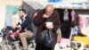 A man eats food that was distributed as aid in a rebel-held besieged area in Aleppo, Syria, Nov. 6, 2016. "The last food rations are being distributed as we speak,” a U.N. official says.