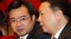 FILE - Nguyen Thanh Nghi, left, pictured with Vietnamese Vice Minister of National Resources and Environment Tran Hong Ha in 2011, has become one of the youngest provincial party chiefs in Vietnam at age 39.