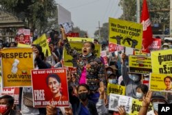 FILE - Demonstrators protest against Myanmar's military junta in Mandalay, Myanmar, Feb. 18, 2021.