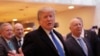 FILE - U.S. President Donald Trump talks to journalists as he arrives during the annual meeting of the World Economic Forum in Davos, Switzerland, Jan. 25, 2018. 