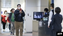 2020年1月13日，台灣疾病控制中心使用人體檢測儀在桃園機場檢測從武漢飛抵台北旅客的體溫。