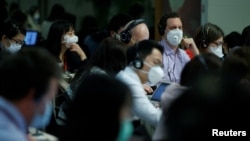 資料圖：記者在中國外交部舉行的例行記者會上（2020年3月18日）