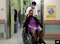 Ken Tsang, a member of a local pro-democracy political party appears at a hospital to examine his condition of an injury during a clash between protesters and police in an occupied area near government headquarters in Hong Kong, Oct. 15, 2014.