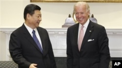 時任中國國家副主席習近平2012年2月14日訪問白宮時與美國副總統拜登會晤
