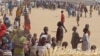 FILE - People who fled their homes due to violence from the militant group Boko Haram are seen inside a refugee camp in Minawao, Cameroon, Feb. 25, 2015.
