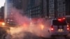 This image provided by Mongolia National Emergency Management Agency, shows a building, right, damaged by an explosion in Ulaanbaatar, Mongolia Jan. 24, 2024. A truck carrying 60 tons of liquefied natural gas and a car collided at an intersection in the Mongolian capital.