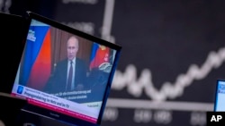 Ілюстрація: Сюжет про російську пропаганду на німецькому телебаченні. AP Photo/Michael Probst
