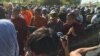 Police Block Mourners During Memorial for 2014 Killings of Workers