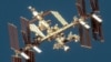 FILE - A satellite image shows an overview of the International Space Station with the Boeing Starliner spacecraft, June 7, 2024. (Maxar Technologies/Handout via REUTERS)