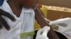 FILE - Staff members of the Teaching Hospital receive the first vaccination treatment for yellow fever in El Geneina, West Darfur, Nov. 14, 2012. 