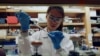 FIA researcher works in a lab at the Duke-NUS Medical School, which is developing a way to track genetic changes that speed testing of vaccines against the coronavirus disease (COVID-19), in Singapore March 23, 2020. (Joseph Campbell/Reuters)