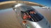 FILE - Selfie picture shows Swiss pioneer Bertrand Piccard during the last leg of the round the world trip with Solar Impulse 2 over the Arab peninsula, July 25, 2016.