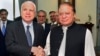 In this photo released by by Pakistan's Press Information Department, visiting U.S. Senator John McCain, left, shakes hand with Pakistani Prime Minister Nawaz Sharif prior to their meeting in Islamabad, July 3, 2017. 