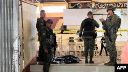 FILE - Philippines ilitary personnel at the site of a bomb attack on Dec. 3, 2023. Khadafi Mimbesa, alleged to be the mastermind of the bombing, died after a clash with troops in January 2024, the military confirmed on Feb. 12, 2024.