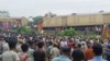 Onlookers watch as rescuers work after a cargo train rammed into Kanchanjunga Express, a passenger train, near New Jalpaiguri station, West Bengal state, India, June 17, 2024. 