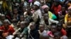 FILE - Refugees who fled Burundi's violence and political tension wait to board a U.N. ship, at Kagunga on Lake Tanganyika, Tanzania, to be taken to the port city of Kigoma, May 23, 2015.