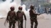 Kenya police officers are seen during an anti-government demonstration over tax hikes and a controversial now-withdrawn tax bill in downtown Nairobi, on July 2, 2024.