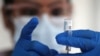 FILE - A nurse draws from a vial of Johnson & Johnson coronavirus vaccine, in Los Angeles, California, March 25, 2021. 