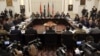 FILE - Delegations from Afghanistan, Pakistan, The United States of America and China discuss a road map for ending the war with the Taliban at the Presidential Palace in Kabul, Afghanistan, Jan. 18, 2016. 