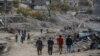 FILE - People arrive in Sirnak city on Nov. 14, 2016, after a 246-day curfew was partially lifted. The curfew in Sirnak, a city of 290,000, was imposed on March 14 as part of operations to eradicate the PKK from eastern Turkey.