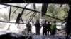 Afghan security forces inspect the site of a suicide bomb attack in Kabul, Afghanistan, Aug. 29, 2017. 