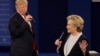 FILE - Republican presidential nominee Donald Trump and Democratic presidential nominee Hillary Clinton speak during the second presidential debate at Washington University in St. Louis, Sunday, Oct. 9, 2016. (AP Photo/Patrick Semansky)