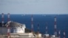 FILE - Oil tankers are seen at the Sheskharis complex, part of Chernomortransneft JSC, a subsidiary of Transneft PJSC, in Novorossiysk, Russia, Oct. 11, 2022. This is one of the largest facilities for oil and petroleum products in southern Russia.