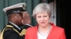 Journée chargée pour May au Nigeria