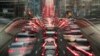 FILE - In this slow-shutter zoom effect photo taken Dec. 12, 2018, commuters are backed up in traffic during the morning rush hour in Brussels, a city that regularly experiences pollution alert warnings.