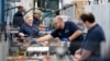 FILE - Employees work in the battery assembly hall at the BMW Spartanburg plant in Greer, South Carolina, on Oct. 19, 2022. Statistics released on Dec. 6, 2024, show the United States added 227,000 jobs in November.