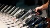 FILE - In this Jan. 19, 2016, file photo, handguns are displayed at the Smith & Wesson booth at a Las Vegas trade show. The Mexican government sued U.S. gun manufacturers and distributors, including some of the biggest names in guns like Smith & Wesson Brands.