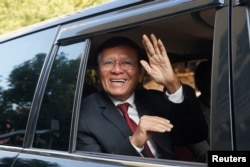 FILE - Former Cambodia National Rescue Party (CNRP) leader Kem Sokha leaves his house for the Phnom Penh Municipal Court for the hearing of the verdict in his treason case where he was was sentenced to 27 years in detention under house arrest after being found guilty, in Phnom Penh, Cambodia, March 3, 2023.
