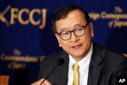 FILE - Cambodia's self-exiled opposition leader Sam Rainsy speaks during a press conference in Tokyo, Japan, April 13, 2018.