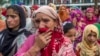 Kashmiri women grieve as they watch funeral of Showkat Ahmed Lohar, a local militant in Arwani, about 55 kilometesr (35 miles) south of Srinagar, India, July 18, 2017. Indian soldiers and police killed three suspected rebels during a brief gun battle Mond