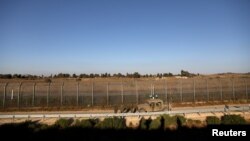 Des soldats israéliens en patrouille dans la partie du Golan syrien occupée par Israël, le 26 juillet 2018.