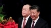 中国国家主席习近平与新任澳门行政长官贺一诚在澳门抵达就职仪式会场。（2019年12月20日）
