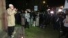 FILE - Members of a Muslim community say a prayer as they gather for a peaceful demonstration at Lakemba in suburban Sydney. 