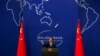 FILE - China's Foreign Ministry spokesman Hong Lei conducts a news conference in Beijing.