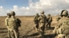 FILE - U.S. soldiers gather at a military base north of Mosul, Iraq, Jan. 4, 2017. The U.S. on Monday shut its Iraqi military headquarters controlling American ground operations against Islamic State. 