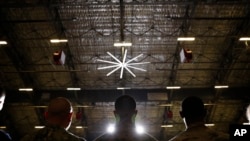 FILE - Members of the military attend a ceremony at Andrews Air Force Base, Md., Dec. 20, 2019. Suicides in the active-duty Air Force surged last year to the highest in at least three decades, even as other services's numbers stabilized or declined.