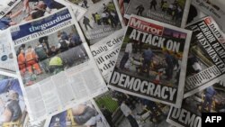 An arrangement of newspapers pictured in London on March 23, 2017, as an illustration, shows the front pages of the UK daily newspapers reporting on the March 22 terror attack.