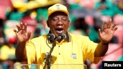 President of South Africa's governing African National Congress Cyril Ramaphosa waves to his supporters, as he arrives for the party's final rally at Ellis Park Stadium in Johannesburg, South Africa, May 5, 2019.