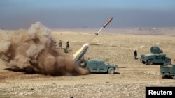  Des membres des Forces irakiennes de réaction rapide au sud de Mossoul, Irak, le 19 février 2017. (REUTERS/Khalid al Mousily )