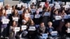 Environmental activists demonstrate in front of the convention center hosting international negotiations on reducing plastic pollution, in Busan, South Korea, on Nov. 29, 2024.