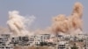 Smoke rises after airstrikes on a rebel-held part of the southern city of Daraa, Syria, June 15, 2017. 