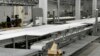 FILE - A few employees are at work in April 2012 inside Northern Beef Packers in Aberdeen, S.D., which raised construction money through the federal EB-5 immigration program. The plant later went bankrupt.