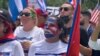 Una cubana protesta frente a la Casa Blanca el lunes 26 de julio. [Foto: VOA/Jorge Agobian]